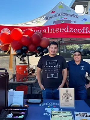 After: The team under the red local coffee shop tent