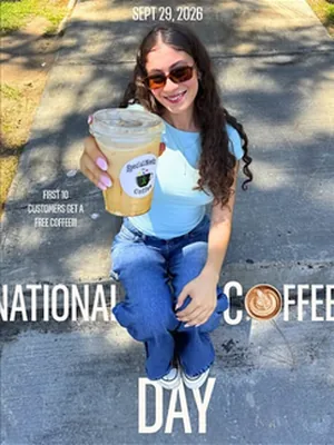 After: A customer holding a drink for National Coffee Day