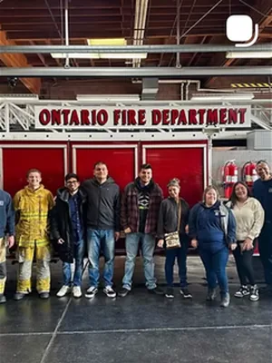 Before: A group photo in front of the Ontario Fire Department