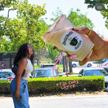 A woman holding up a cup, with Happy awareness day written on it
