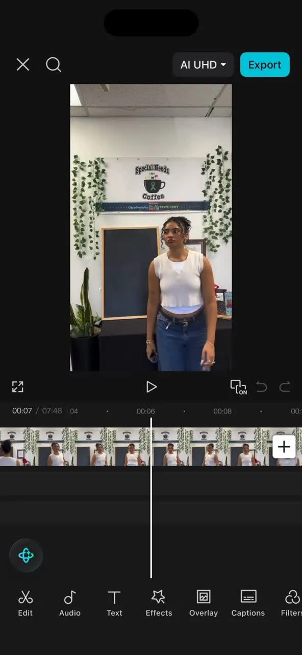 A phone showing a video being edited, with the timeline along the bottom